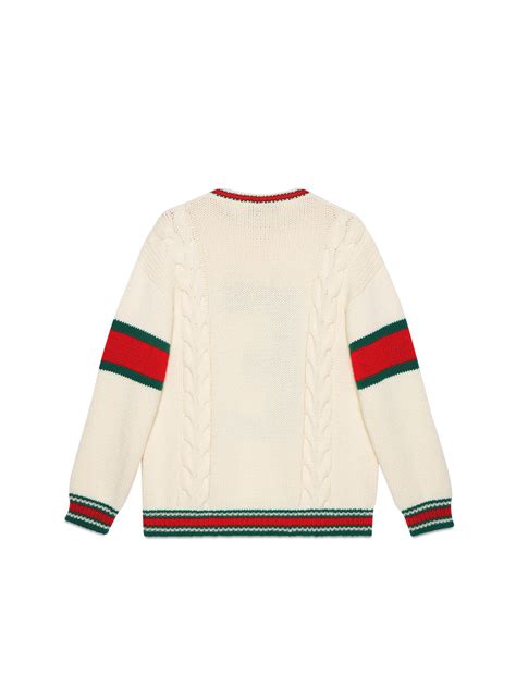 maglione gucci con due faccie di lupo|Maglione blu con pattern logo Gucci .